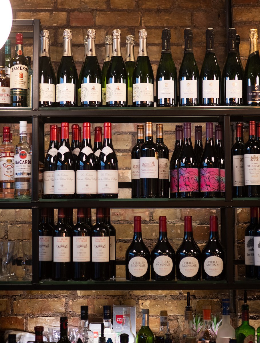 Wine bottle shelves at La Petite Colline, Muswell Hill